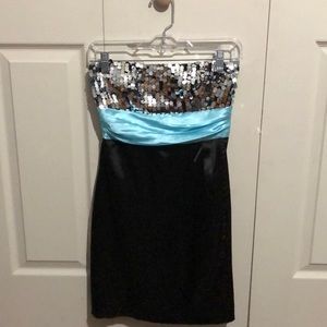 Black mini dress with sequin top and aqua sash.